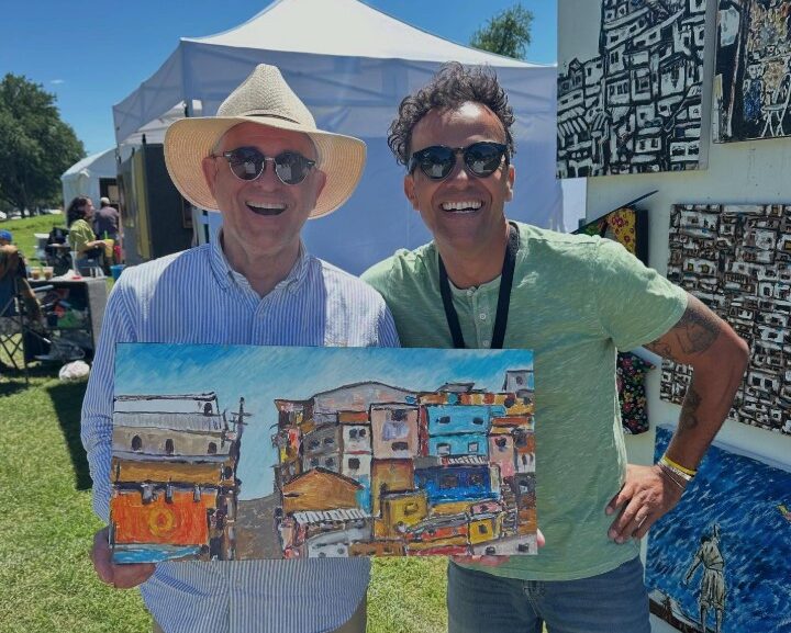 Tony Parnana with an art buyer